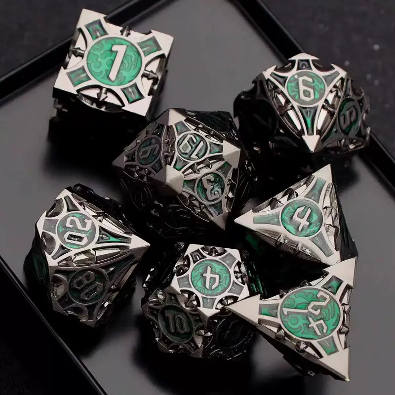 Gunmetal Green Hollow Metal Dice — Openwork gunmetal-black metal with teal-green enamel, silver ink.