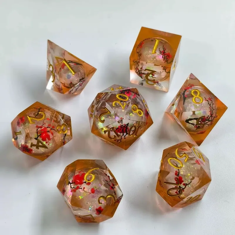 Amber Plum Blossom Resin Dice — Sharp-edge resin with red plum-blossom inclusions and opal glitter, gold ink.