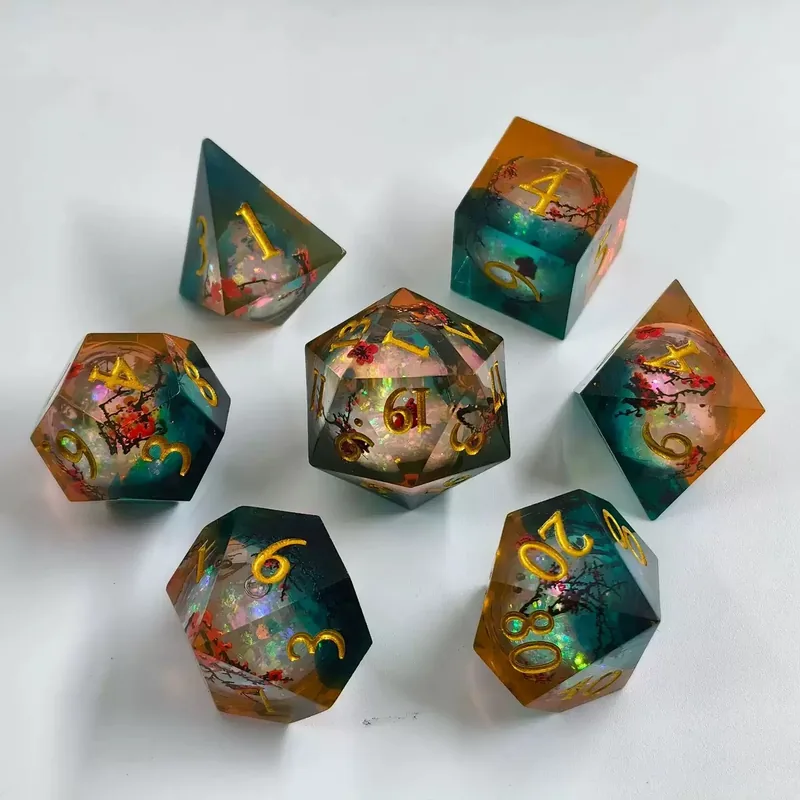 Teal & Amber Plum Blossom Resin Dice — Two-tone teal and amber sharp-edge resin with plum-blossom inclusions, gold ink.